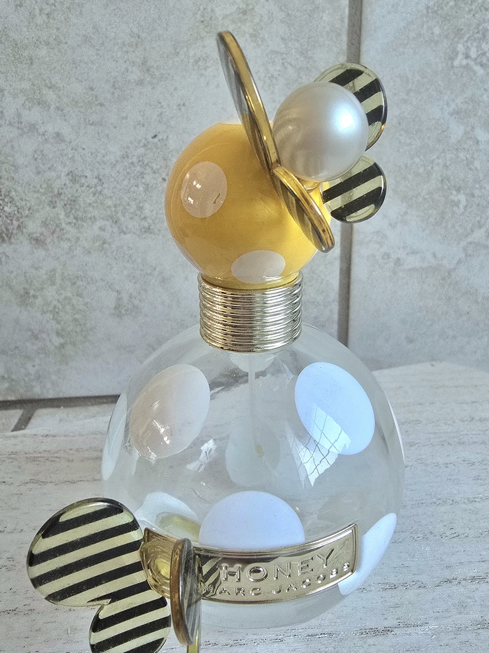 Marc Jacobs Clear Bottle with Yellow Polka Dot Cap and Gold Accents
